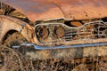 Old vintage rusted out carÃ¢â¬â¢s headlight / grill area Royalty Free Stock Photo